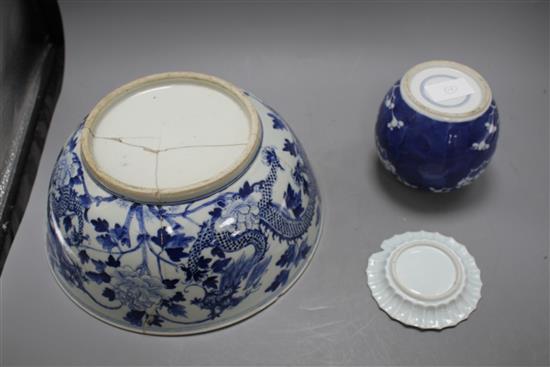 A large Chinese blue and white bowl, 29.5cm a prunus jar, height 12cm and a Kangxi blue and white fluted saucer, 11cm